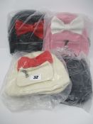 Two as new The Bow Mini Backpack black with red bow. One as new The Bow Mini Backpack white with red