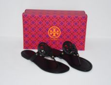One as new Tory Burch Miller calf leather perfect black sandals size US 9.5. One as new Reebok DMX