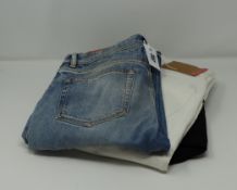 One as new Acne Studios North White Denim jeans (size unknown). One as new Acne Studios North Blue