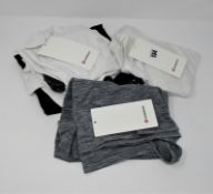 One as new white Swifty Tech Racerback 2.0 size 10 (some marks on the front. Security tag attached).