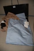A pair of as new Marina Rinaldi sky blue Rio 48 wide leg trousers (Size 18, RRP £245). A pair of