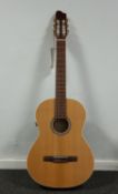 One boxed Godin La Patrie Teude QIT classical electro-acoustic guitar (As new condition).