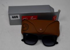 A pair of as new Ray Ban sunglasses.