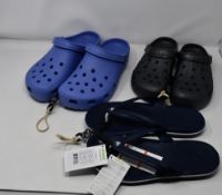 One as new Crocs Classic Lapis clog size UK 11. One as new Crocs Baya Graphite clog size UK 8. One