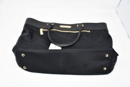 One as new Michael Kors black tote bag.