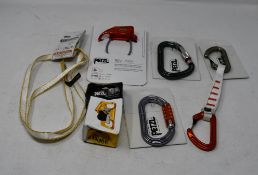 A quantity of boxed as new Petzl sport climbing equipment to include one Petzl Ange Finesse