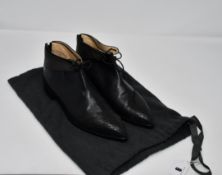 A pair of pre owned Bionda Castana black flat shoes with engraved decoration on the tip and on the