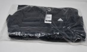 One woman's as new Adidas Varilite Down black jacket size XS (BQ1968).