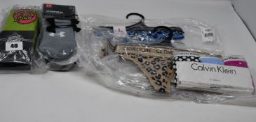 One as new Santa Cruz Pop Dot socks size UK 4-7 (pack of 3). One as new Under Armour crew socks size