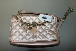 One pre-owned Guess Victoria Quilted Convertible Crossbody pink bag (VG710721. One scratch on the