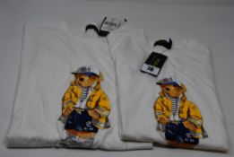 Two as new classic Ralph Lauren white t-shirt with bear motif to the front (XS, XL).