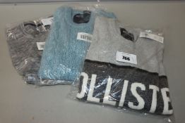 One as new Hollister grey shirt size M. One as new Hollister light blue knit sweater size S. One