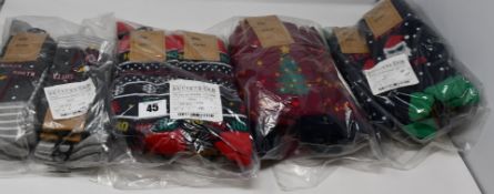 Twelve as new M&Co Christmas three socks pair. Twelve pairs of as new M&Co Ho Ho Ho Christmas socks.