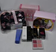 Two Glow Recipe My Glow vanity sets, a Niu Body Glow kit and Adrienne Vittadini cosmetic bags set