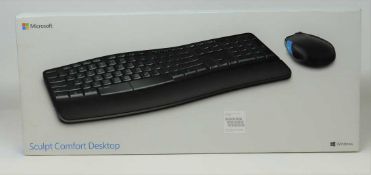 A boxed as new Microsoft Sculpt Comfort Desktop Keyboard. Box sealed.