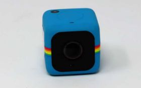 A pre owned Polaroid Cube+ 1080p HD Weatherproof Action Camera with Micro SD slot in Blue.