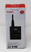 A boxed as new Canon LC-E10E Battery Charger (Box opened, some cosmetic damage to box).