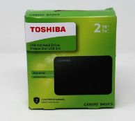 A boxed as-new Toshiba 2 TB External Portable Hard Drive USB 3.0 Black Canvio Basics. Box sealed.