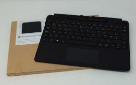 A pre-owned Microsoft Surface Pro X Signature Keyboard with Slim Pen.
