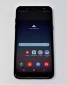 A pre-owned Samsung Galaxy A6 2018 32GB SM-A600FN in Black (FRP clear. Damaged screen glass, some
