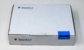 A boxed as-new DoorBird IP Door Chime A1061W White Edition. Box sealed, cosmetic damage to box.