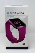 A boxed as new Fitbit Versa Lite Smart Watch in Mulberry (Box sealed).