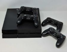 A pre-owned Sony PS4 500GB in Jet Black (CUH-1115A) with four controllers. Requires UK adaptor.