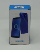 A boxed as new Acatel3x Smartphone in Metallic Blue 32GB 3GB RAM (box damaged, sealed).