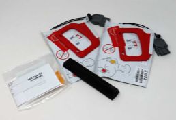 A boxed as new Physio Control CHARGE-PAK Battery Charger Stick & 2 QUIK-PAK Electrodes (Part #: