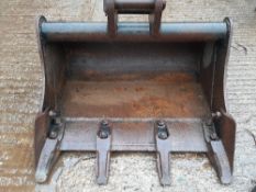 Second hand 600 mm digger bucket with 30 mm pins and 125 mm pin centres. Stored near Eye, Suffolk.