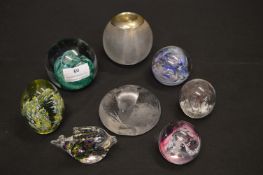Seven Glass Paperweights and Glass Match Striker