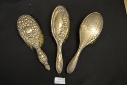 Three Silver Brushes