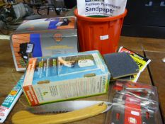 Floodlight, Hand Wash Dispenser, and a Tub of Sand