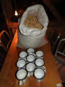 *Nine Enamel Cups and a Bag of Peanuts