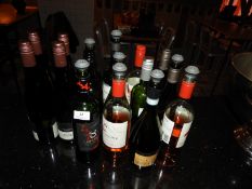 *Four Full Bottles and Various Part Bottles of Win