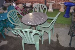 Metal Garden Table and Four Green Plastic Chairs