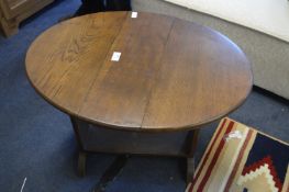 Dark Oak Drop Leaf Oval Occasional Table