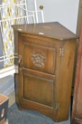 Carved Oak Corner Cupboard