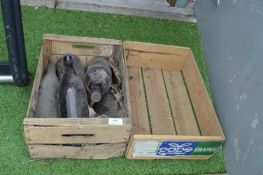 Advertising Crate and a Crate of Glass Bottles