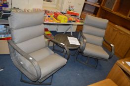 *Two Outdoor Cushion Chairs and a Drinks Table