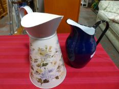 Enamel Jug and a Tin Jug with Floral Design