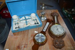 Vintage Items Including Part Picnic Set, Barometers, and a Ships Light on a Gimbal
