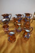 Ten Victorian Copper Luster Jugs
