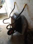 Wheelbarrow and a Cement Mixing Pad