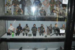 Thirteen Assorted Action Men in Various Military Uniforms