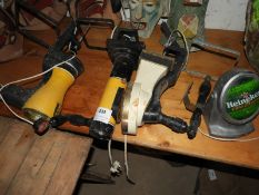 Three Beer Pumps and a Heineken Sign