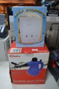 Boxed Delta Handheld Steam Cleaner, and a Soap Dispenser