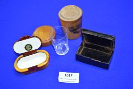 Two Pill Boxes and a Wooden Glass