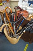 Basket of walking Sticks etc