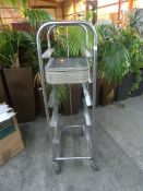 *S/S tray trolley with approx. 30 black trays